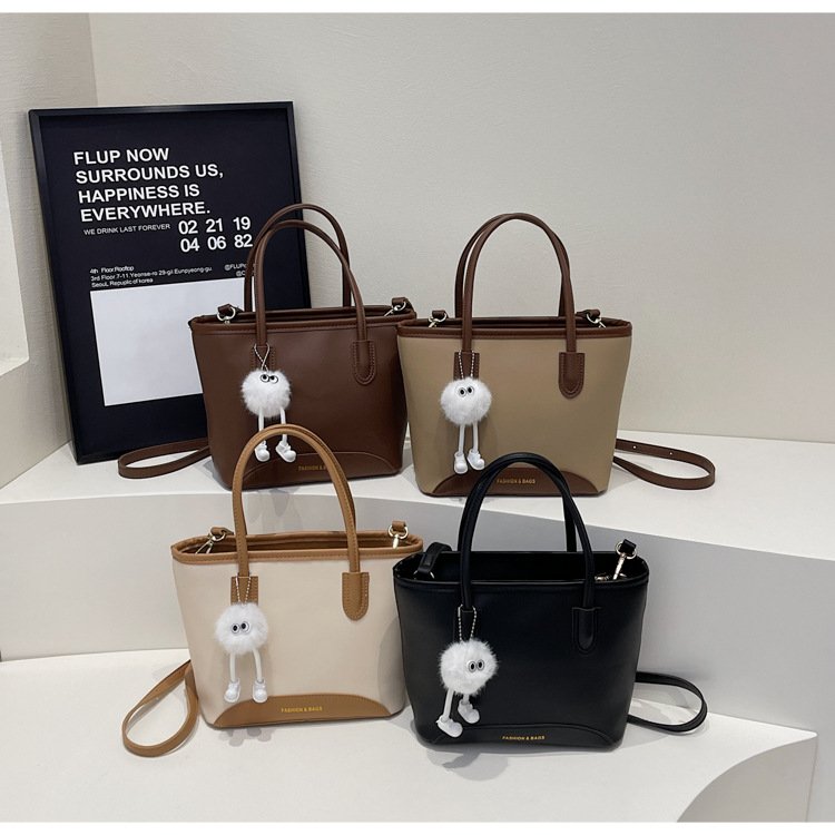 Contrasting color versatile hand-held bucket bag for women's spring simple and high-end niche one-shoulder crossbody bag