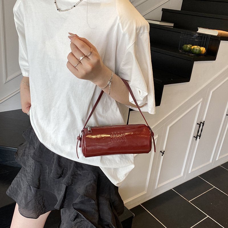 Spring soft cowhide one-shoulder pen holder underarm bag small hand-carrying cylinder women's bag